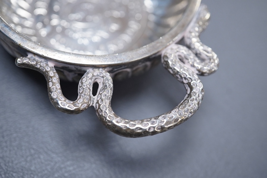 A late 18th century French white metal taste vin, with serpent handle and inset coin base, cockerel mark, 93mm, 96 grams.